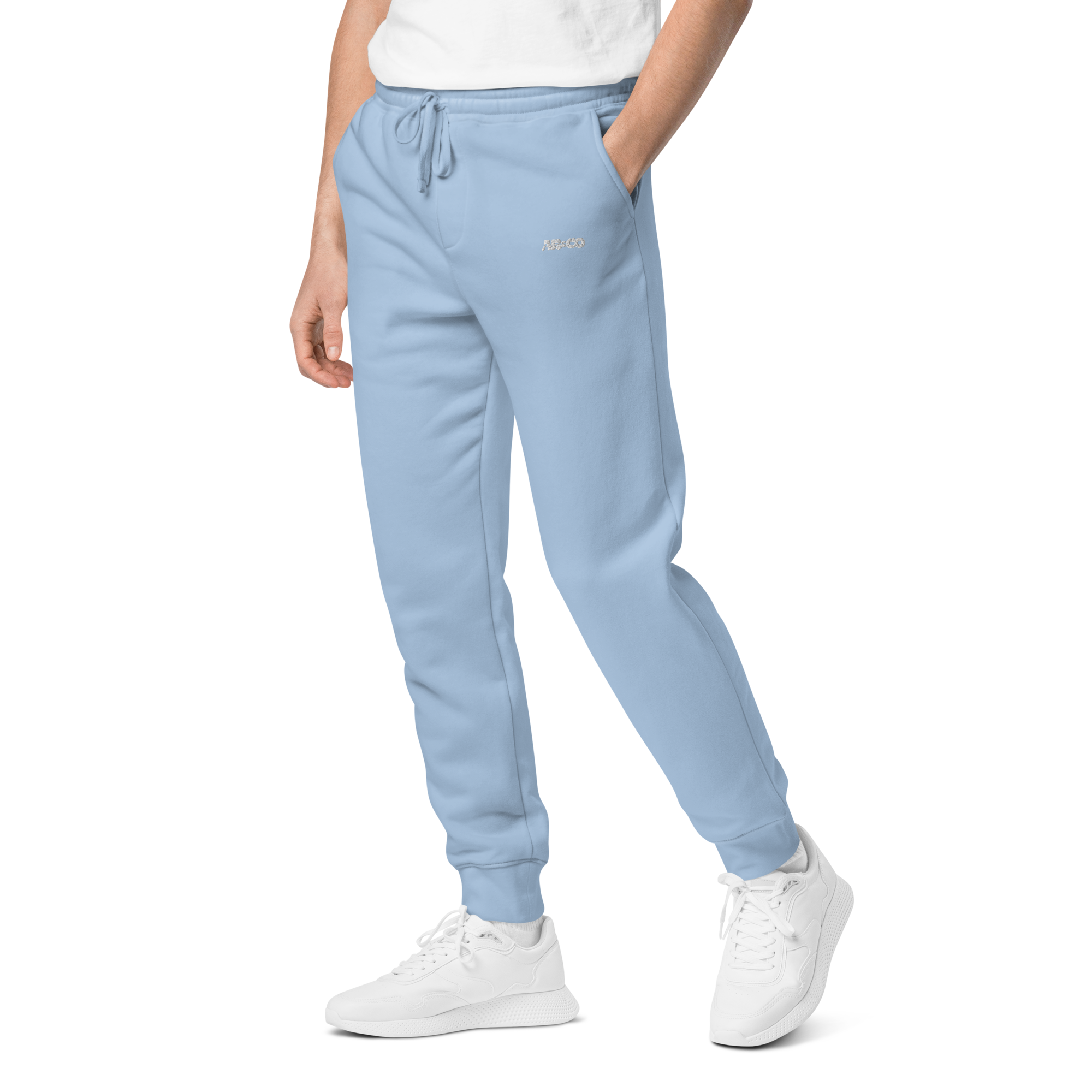 Pigment-dyed relaxed fit sweatpants in Light Blue with elastic waistband and cuffs, designed for streetwear and everyday comfort.