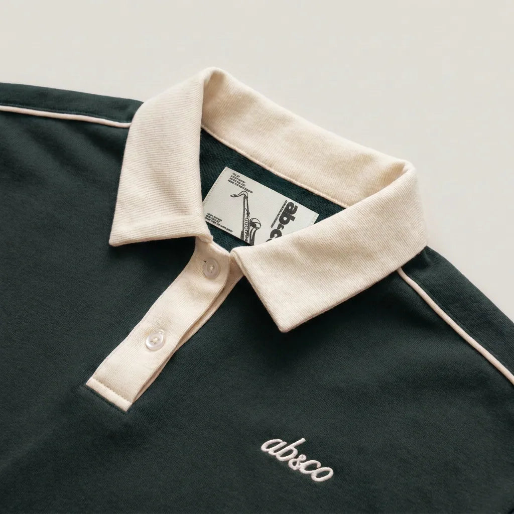 Cream collar and saxophone inner label, peacock teal polo