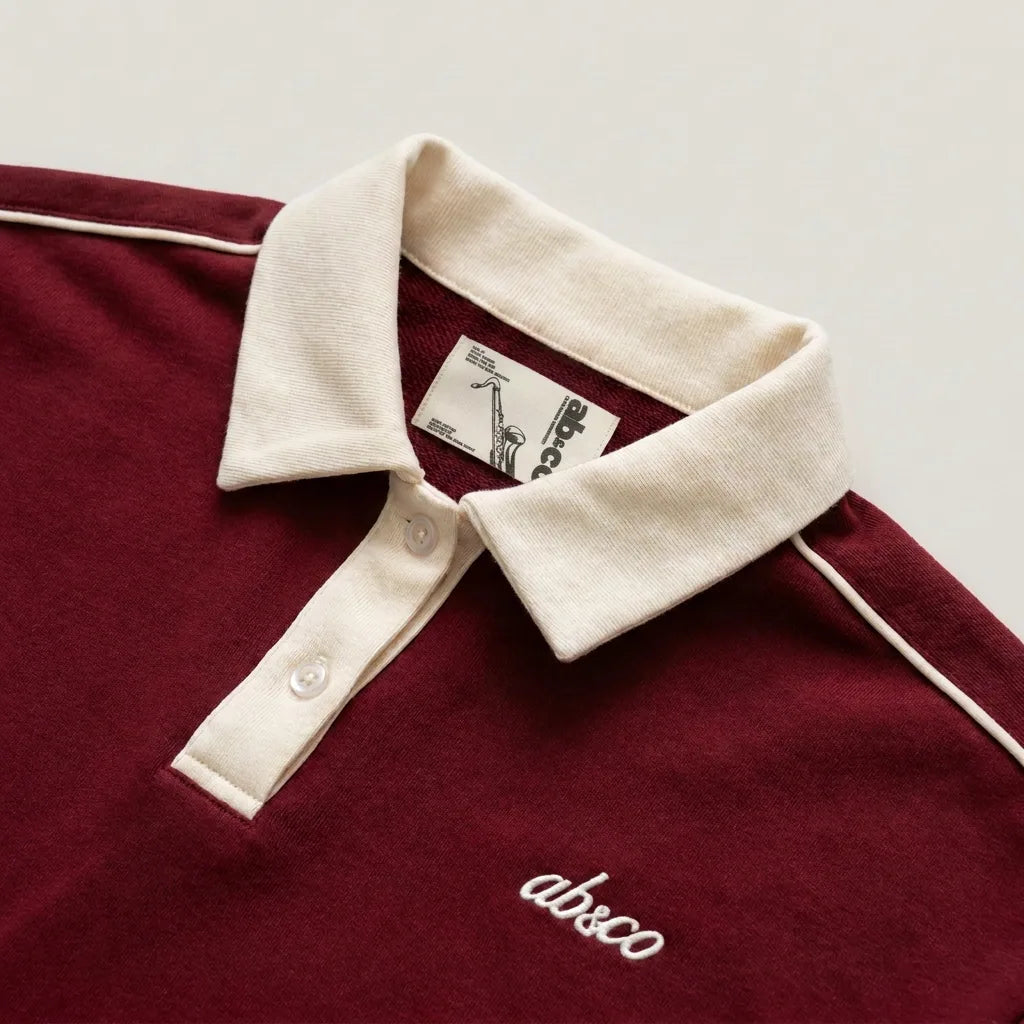 Cream collar and saxophone inner label, pomegranate red polo
