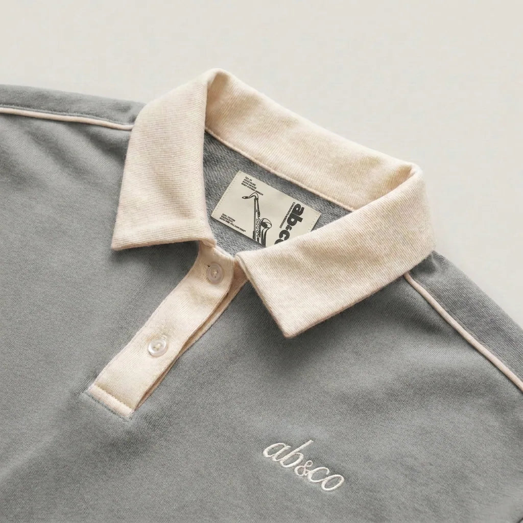 Cream collar and saxophone inner label, slate grey polo