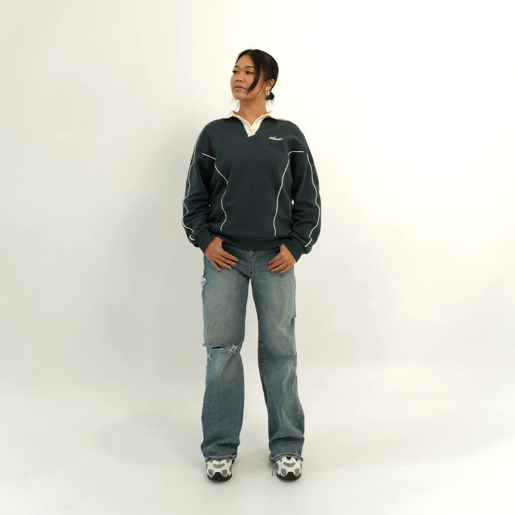 Female model in peacock teal After Hours polo, front