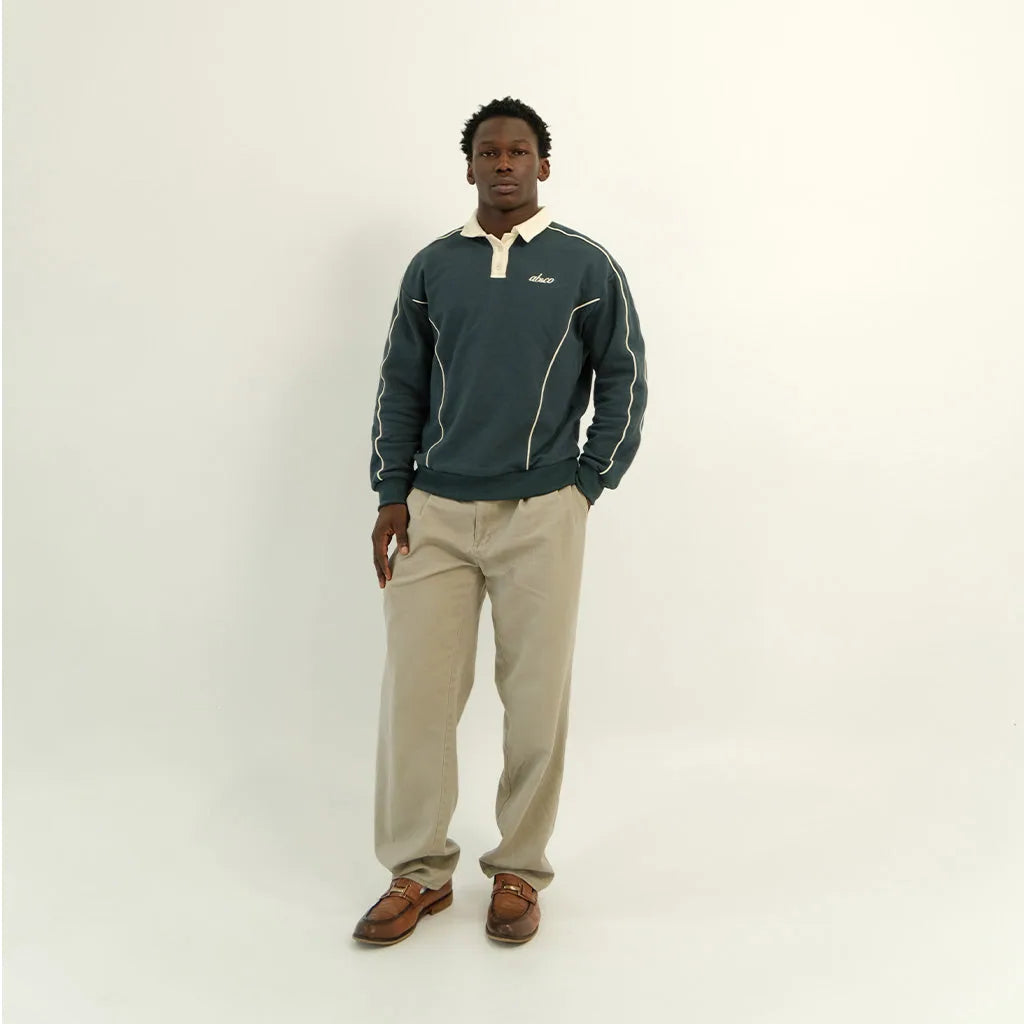 Male model in peacock teal After Hours polo, front