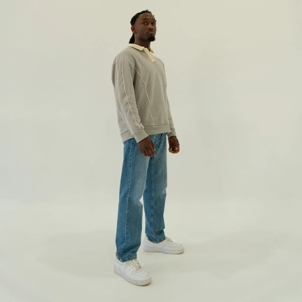 Male model in slate grey After Hours polo, side