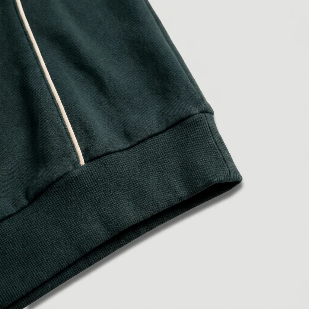 Ribbed hem and cream piping, peacock teal polo