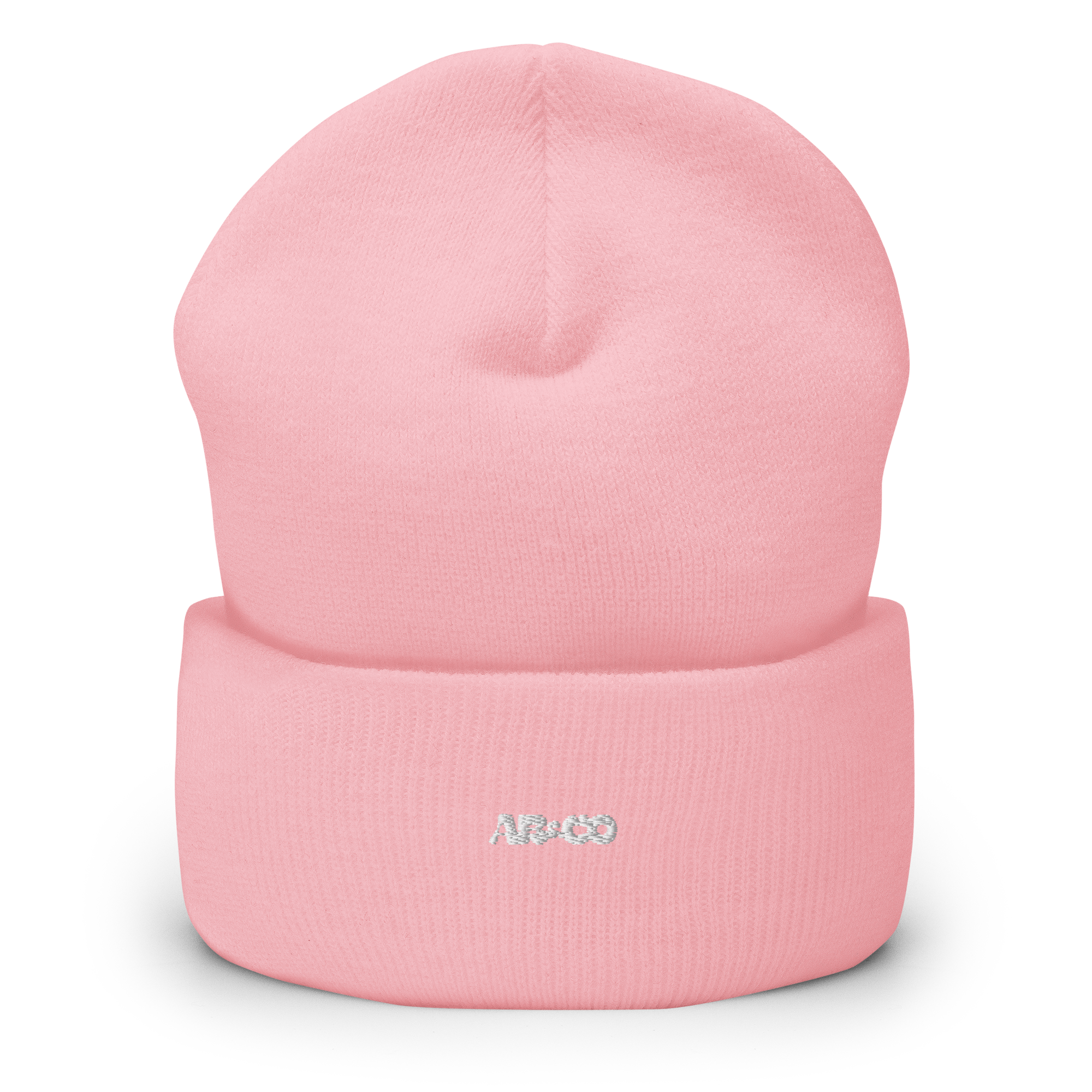 “Cuffed knit beanie in pink with embroidered logo, soft ribbed texture, designed for warmth and everyday streetwear.