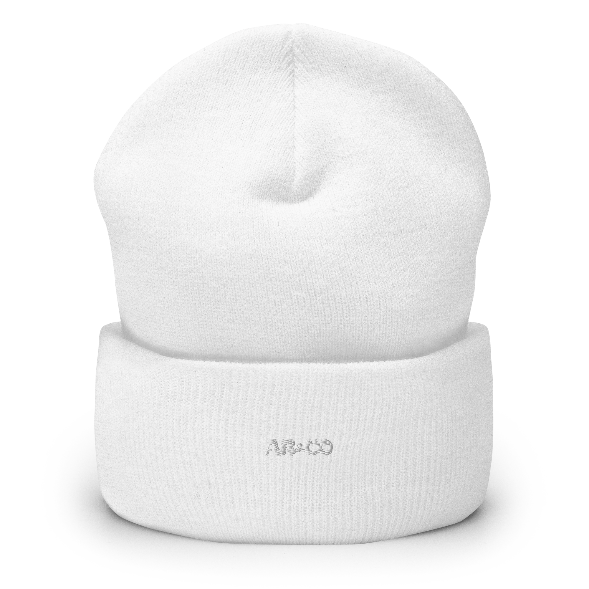 Cuffed knit beanie in white with embroidered logo, soft ribbed texture, designed for warmth and everyday streetwear.
