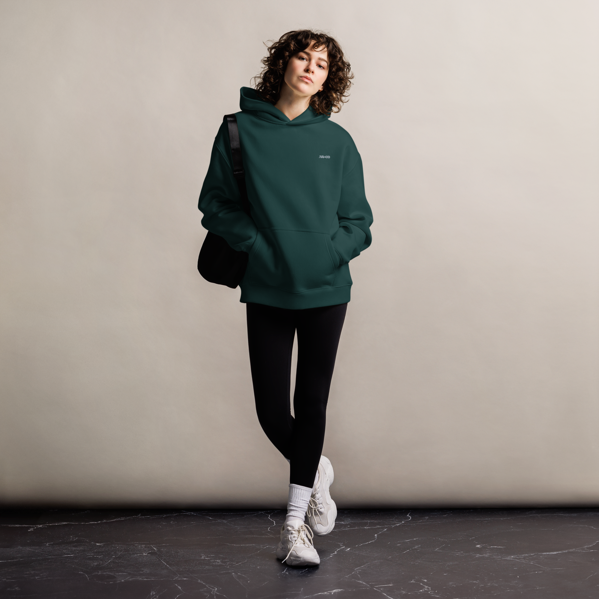 Heavyweight oversized hoodie in Alpine Green with dropped shoulders, double-layer hood, and ribbed cuffs, designed for streetwear and everyday comfort.