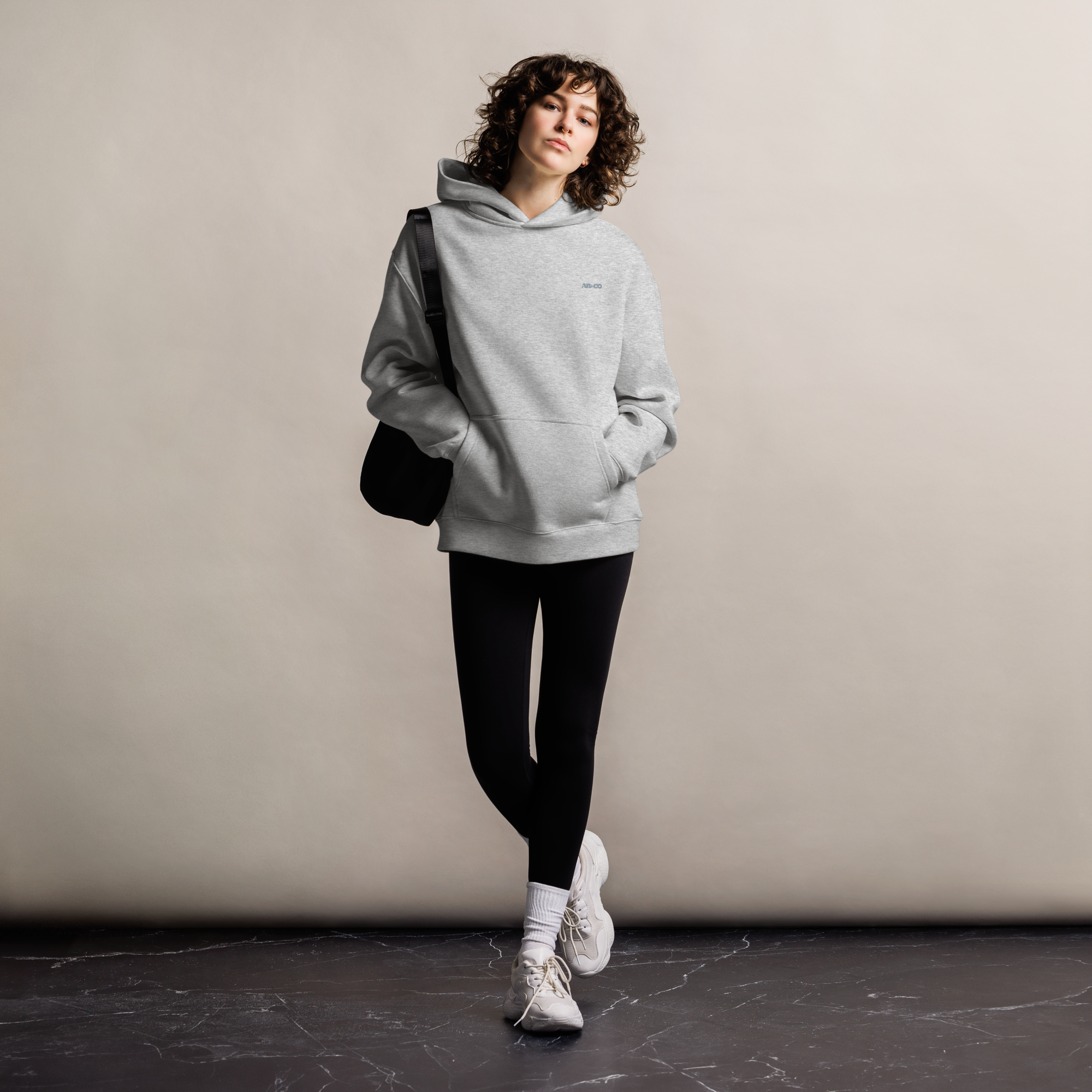 Heavyweight oversized hoodie in Grey with dropped shoulders, double-layer hood, and ribbed cuffs, designed for streetwear and everyday comfort.