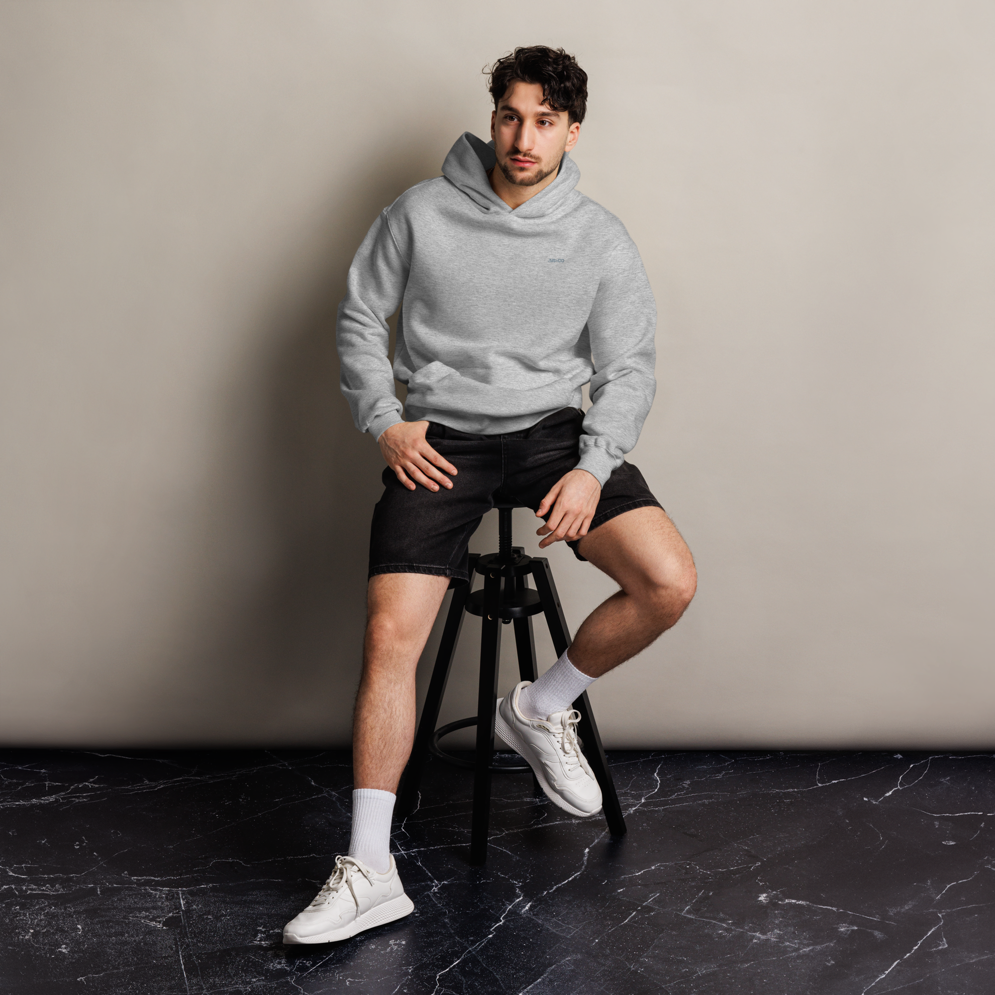 Heavyweight oversized hoodie in Grey with dropped shoulders, double-layer hood, and ribbed cuffs, designed for streetwear and everyday comfort.
