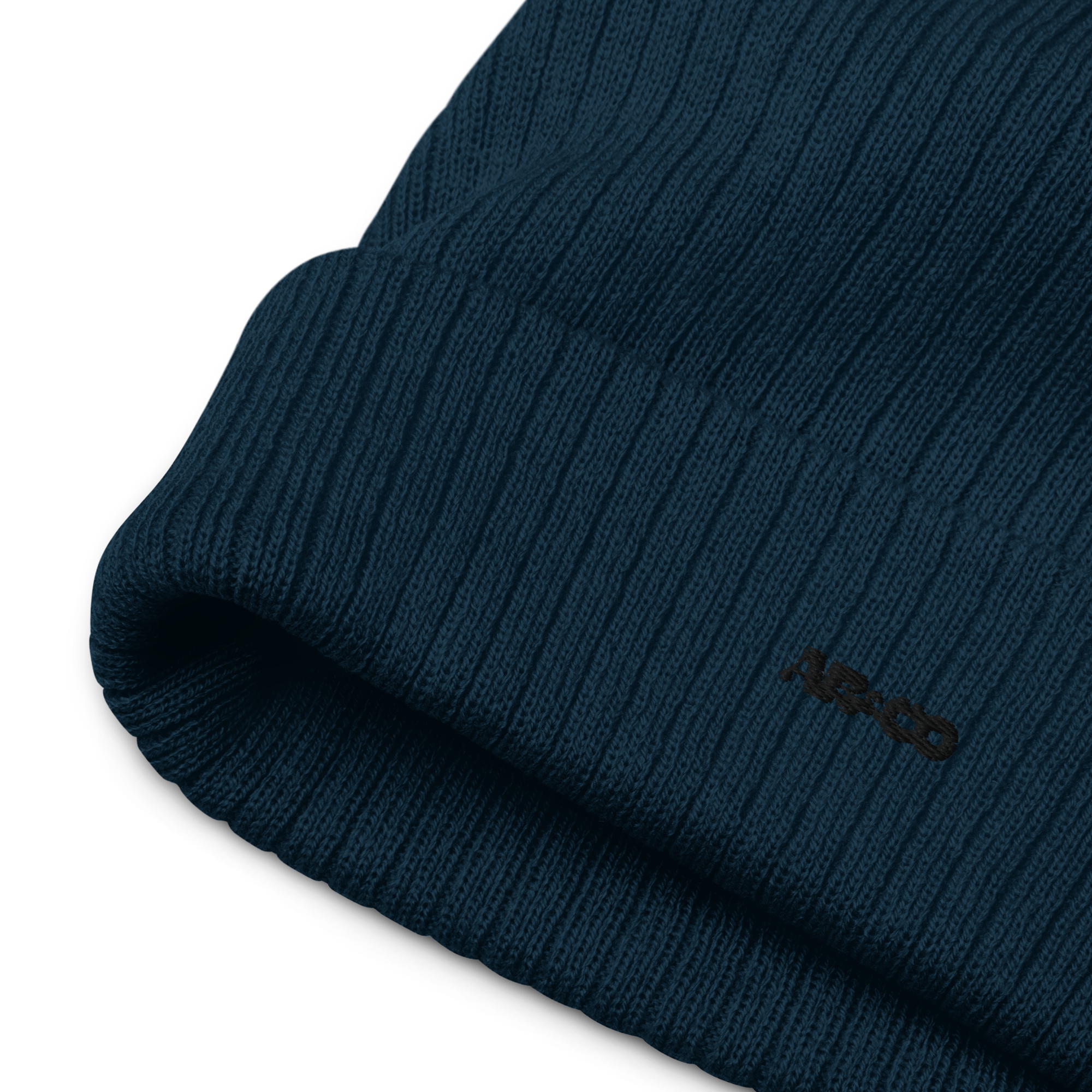 Ribbed knit beanie in Navy with embroidered logo, soft stretch fit, designed for warmth and everyday streetwear.