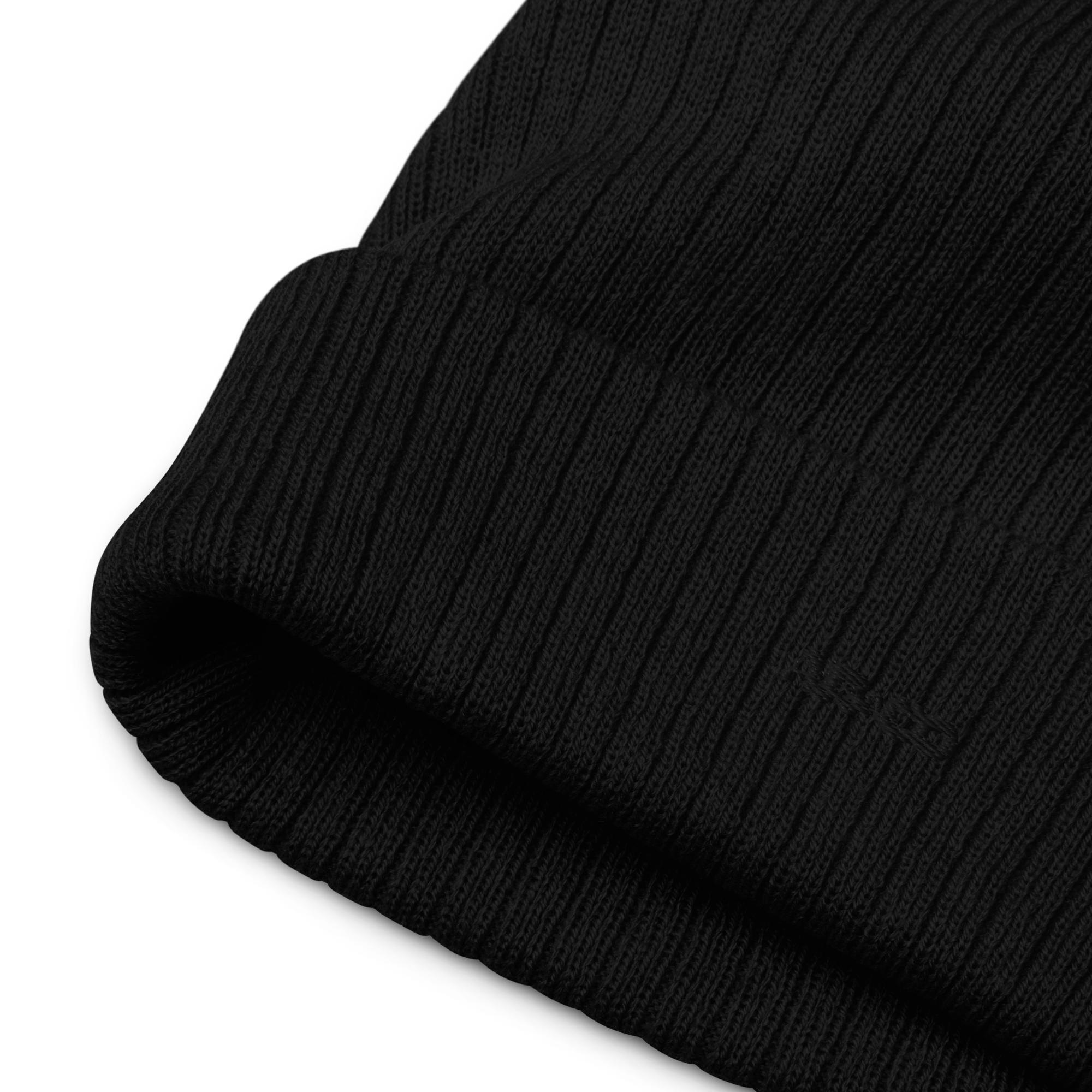 Ribbed knit beanie in Black with embroidered logo, soft stretch fit, designed for warmth and everyday streetwear.