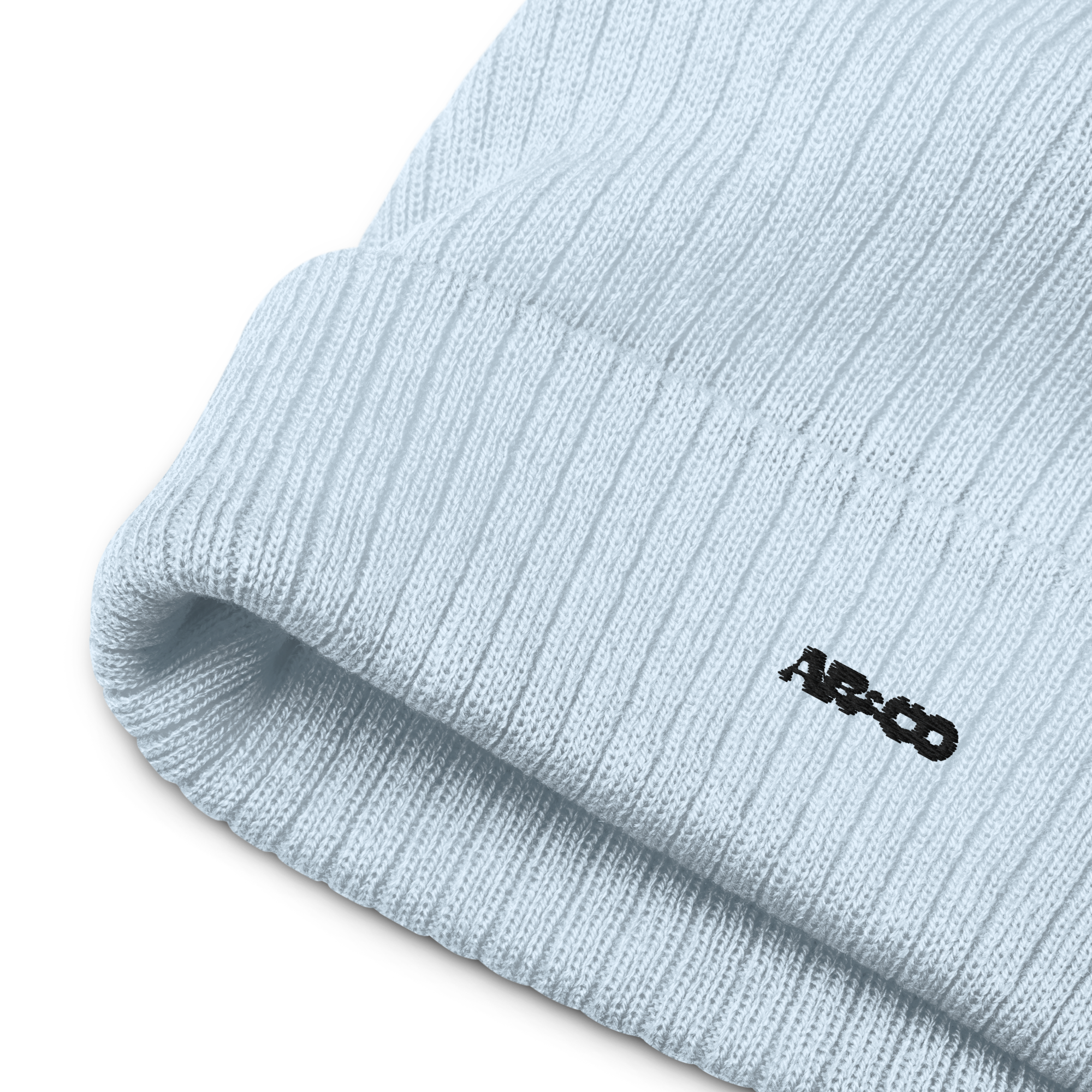 Ribbed knit beanie in blue with embroidered logo, soft stretch fit, designed for warmth and everyday streetwear.