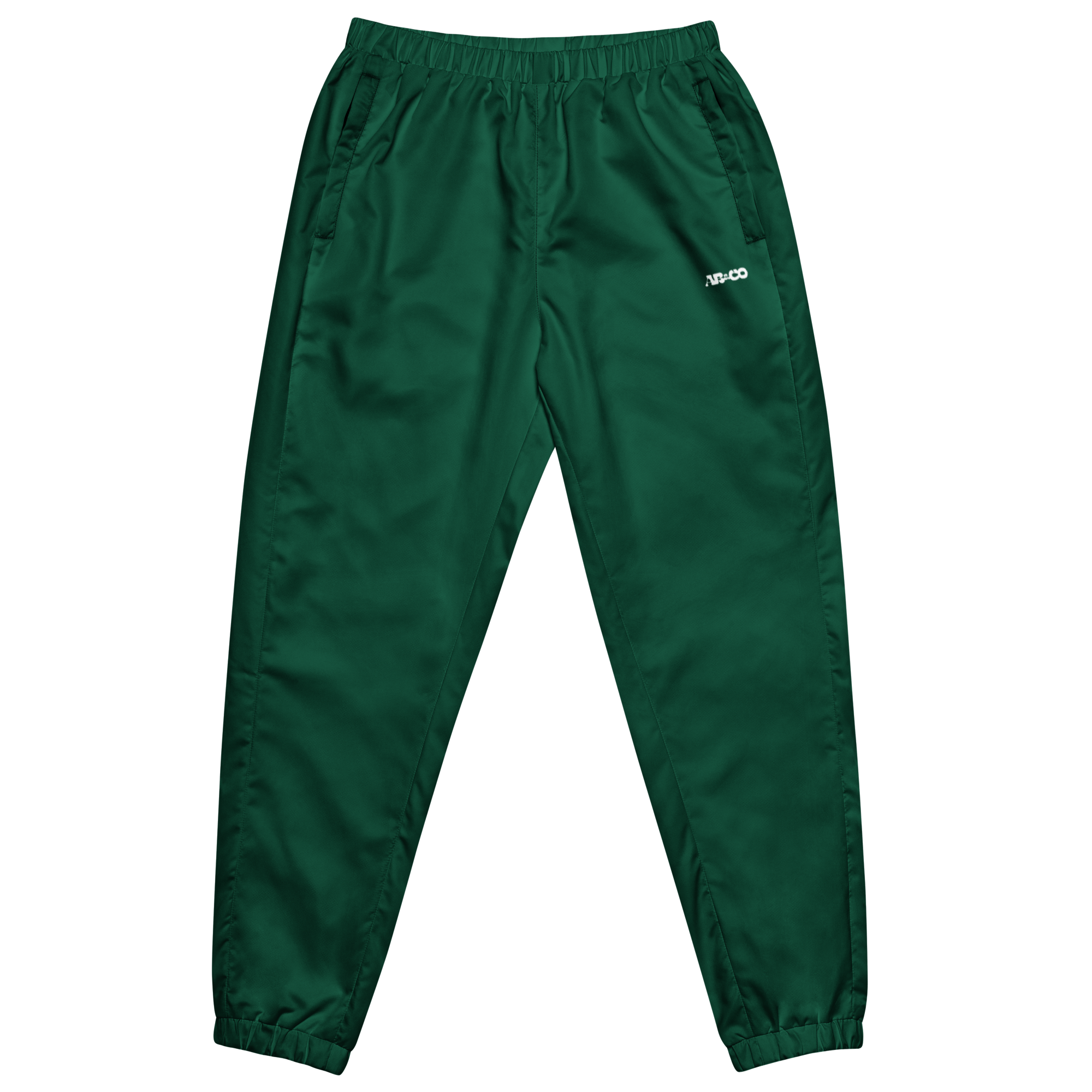 Unisex track pants in Green with elastic waistband, tapered leg, and side pockets. Comfortable fit for streetwear and casual wear.