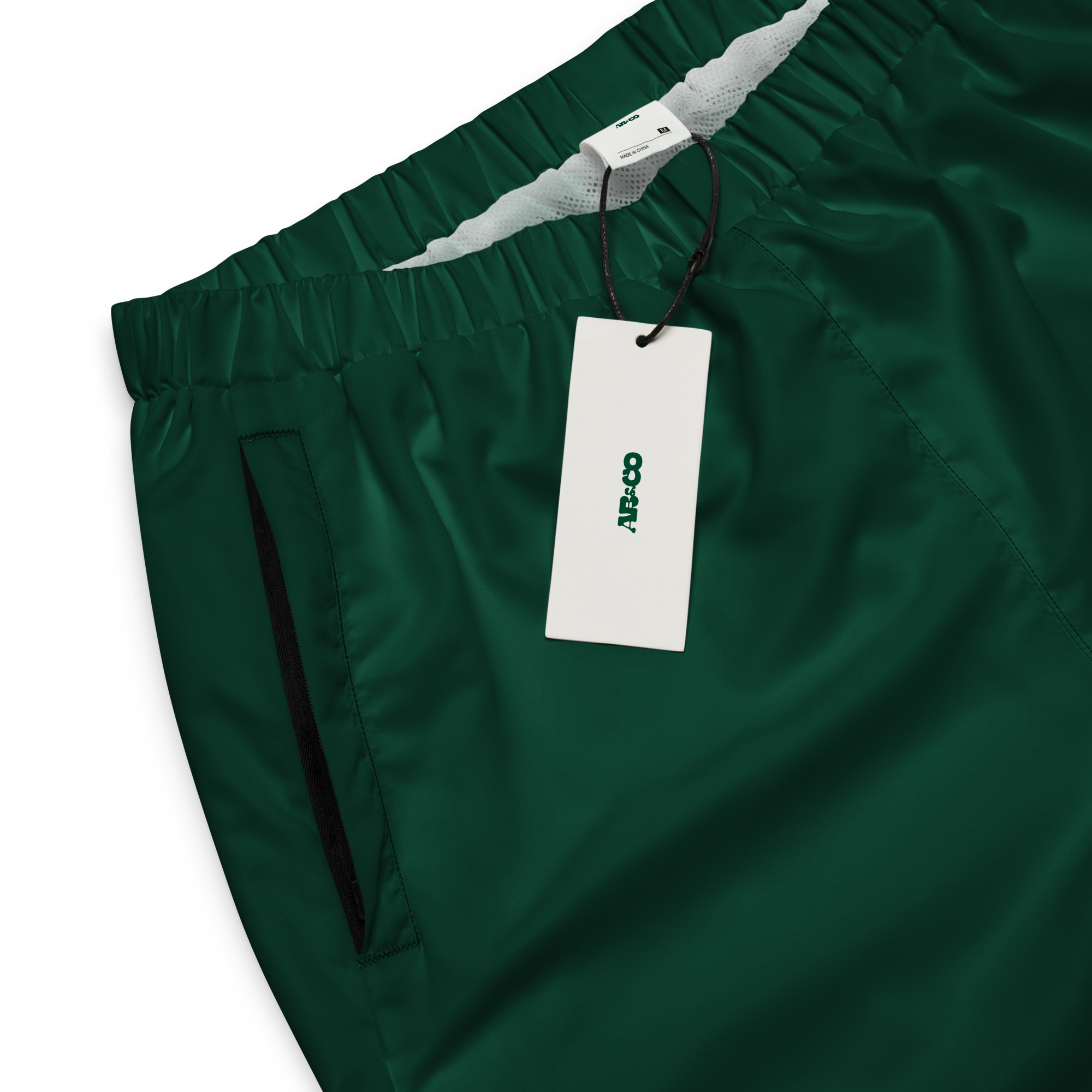 Unisex track pants in Grey with elastic waistband, tapered leg, and side pockets. Comfortable fit for streetwear and casual wear.