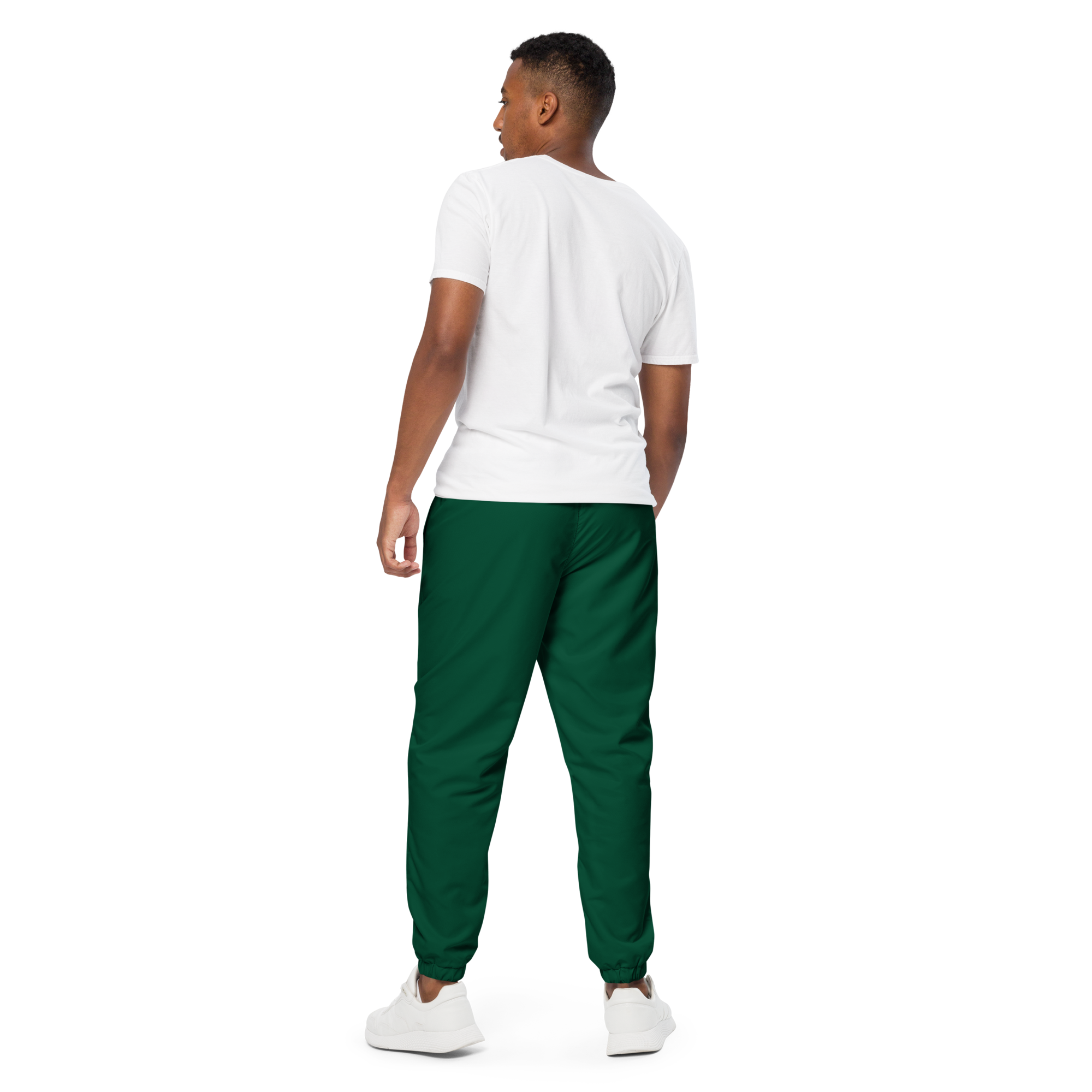 Unisex track pants in Green with elastic waistband, tapered leg, and side pockets. Designed for casual streetwear and comfort.