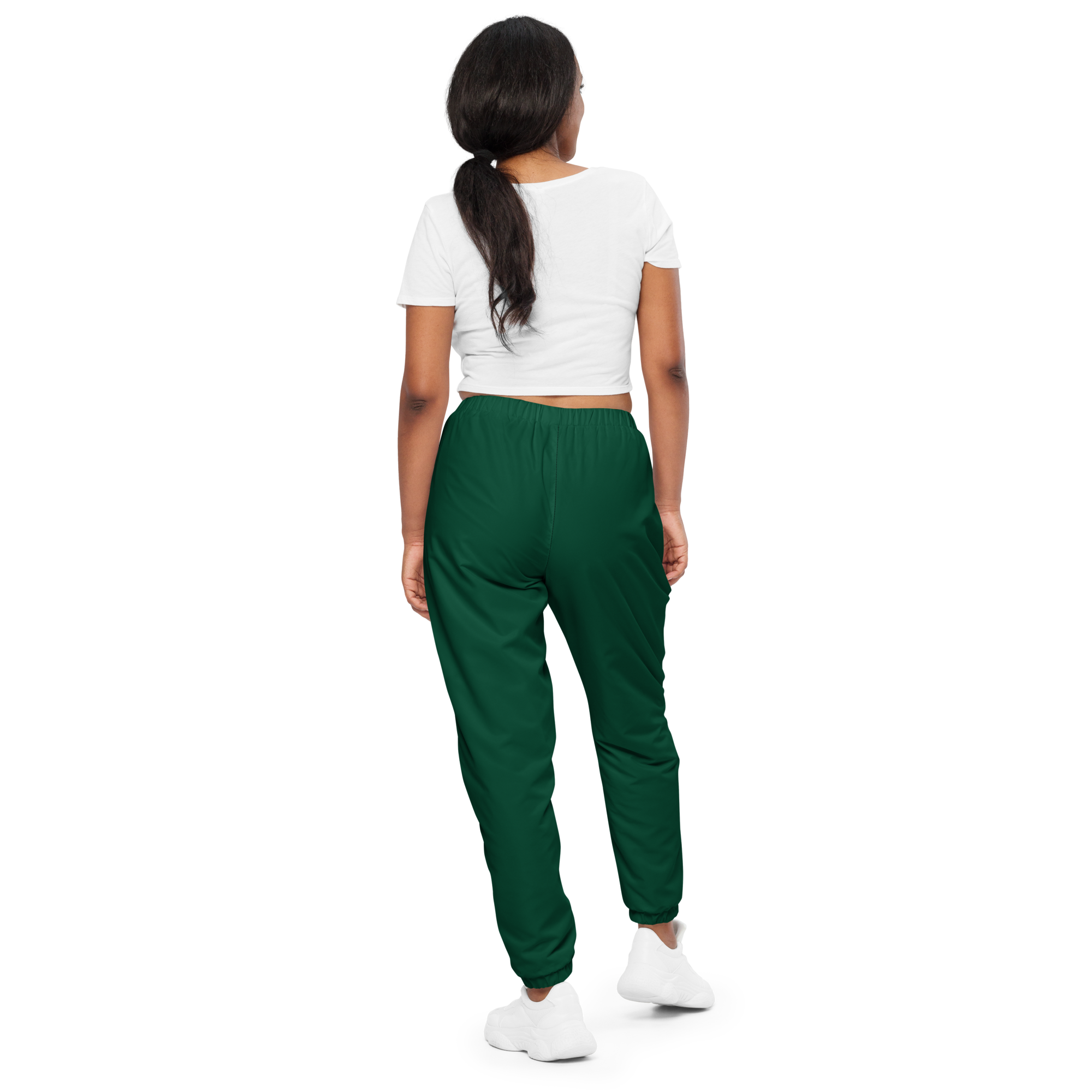 Unisex track pants in Green with elastic waistband, tapered leg, and side pockets. Designed for casual streetwear and comfort.