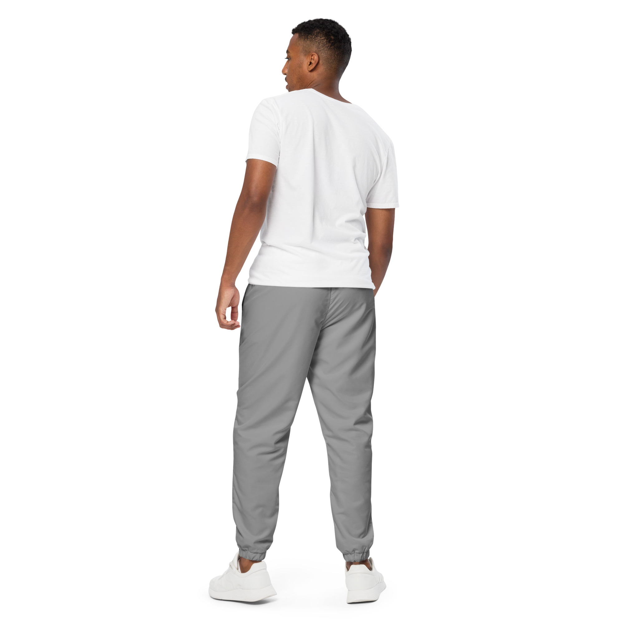 Unisex track pants in Grey with elastic waistband, tapered leg, and side pockets. Comfortable fit for streetwear and casual wear.