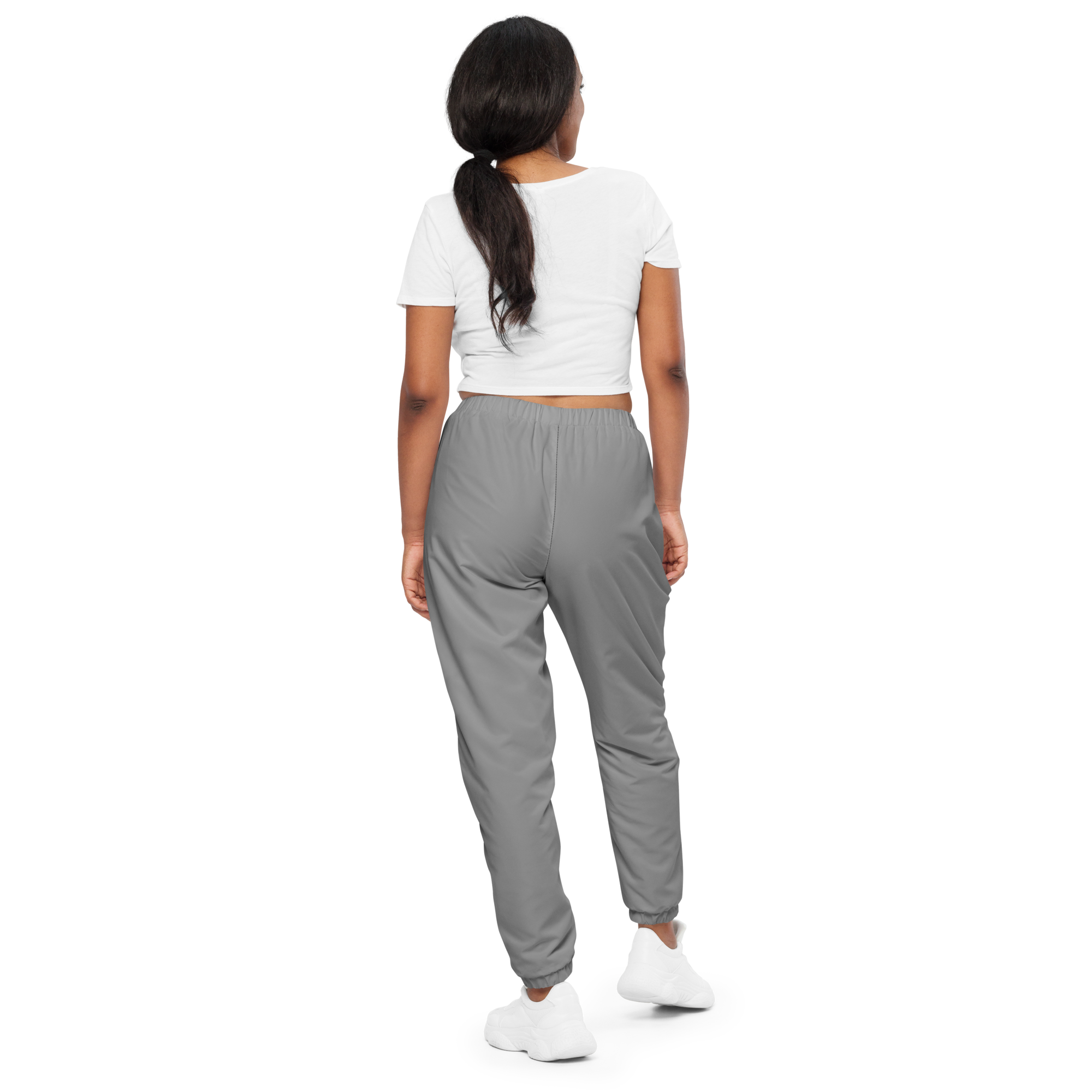 Unisex track pants in Grey with elastic waistband, tapered leg, and side pockets. Comfortable fit for streetwear and casual wear.