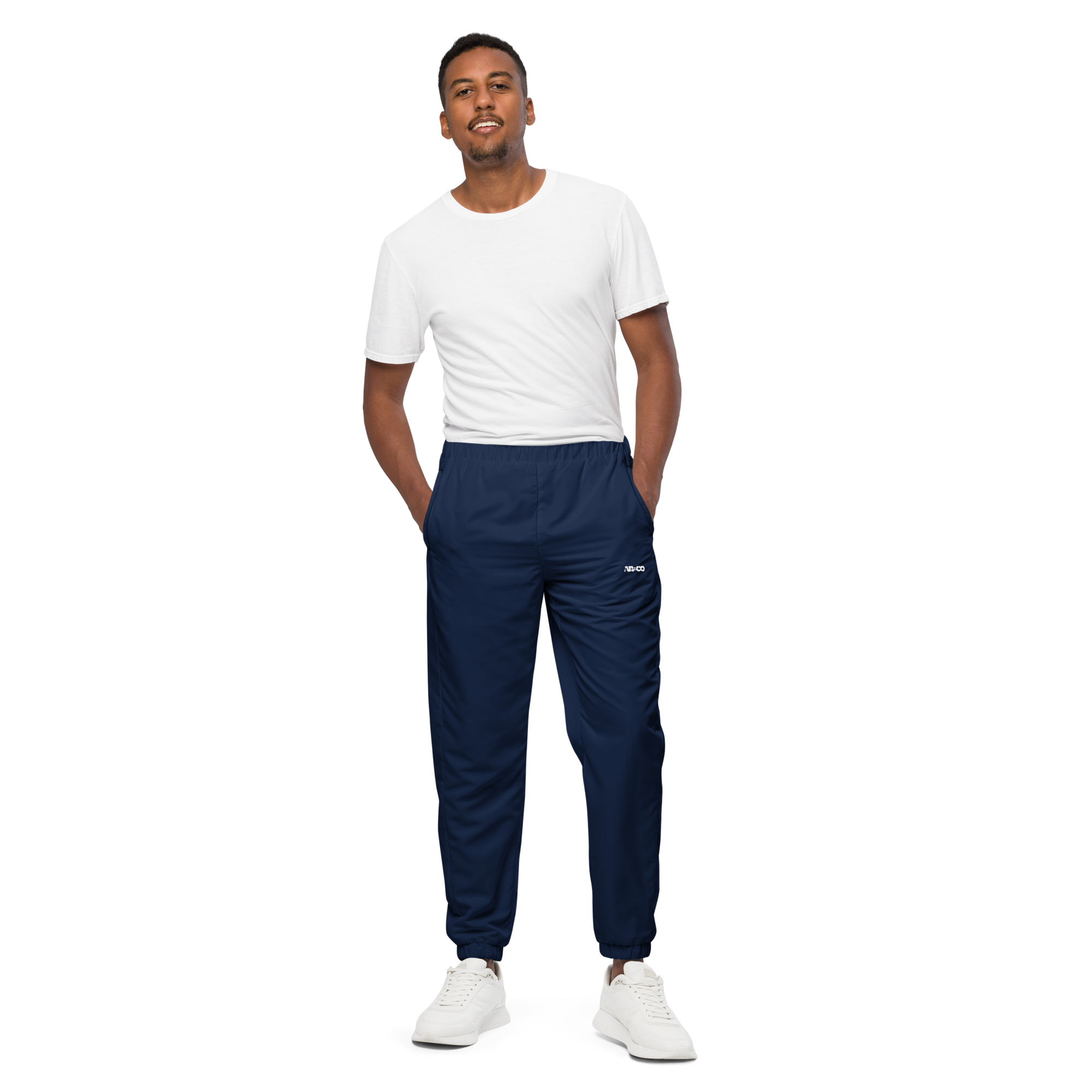 Unisex track pants in Navy Blue with elastic waistband, tapered leg, and side pockets. Relaxed streetwear style for everyday wear