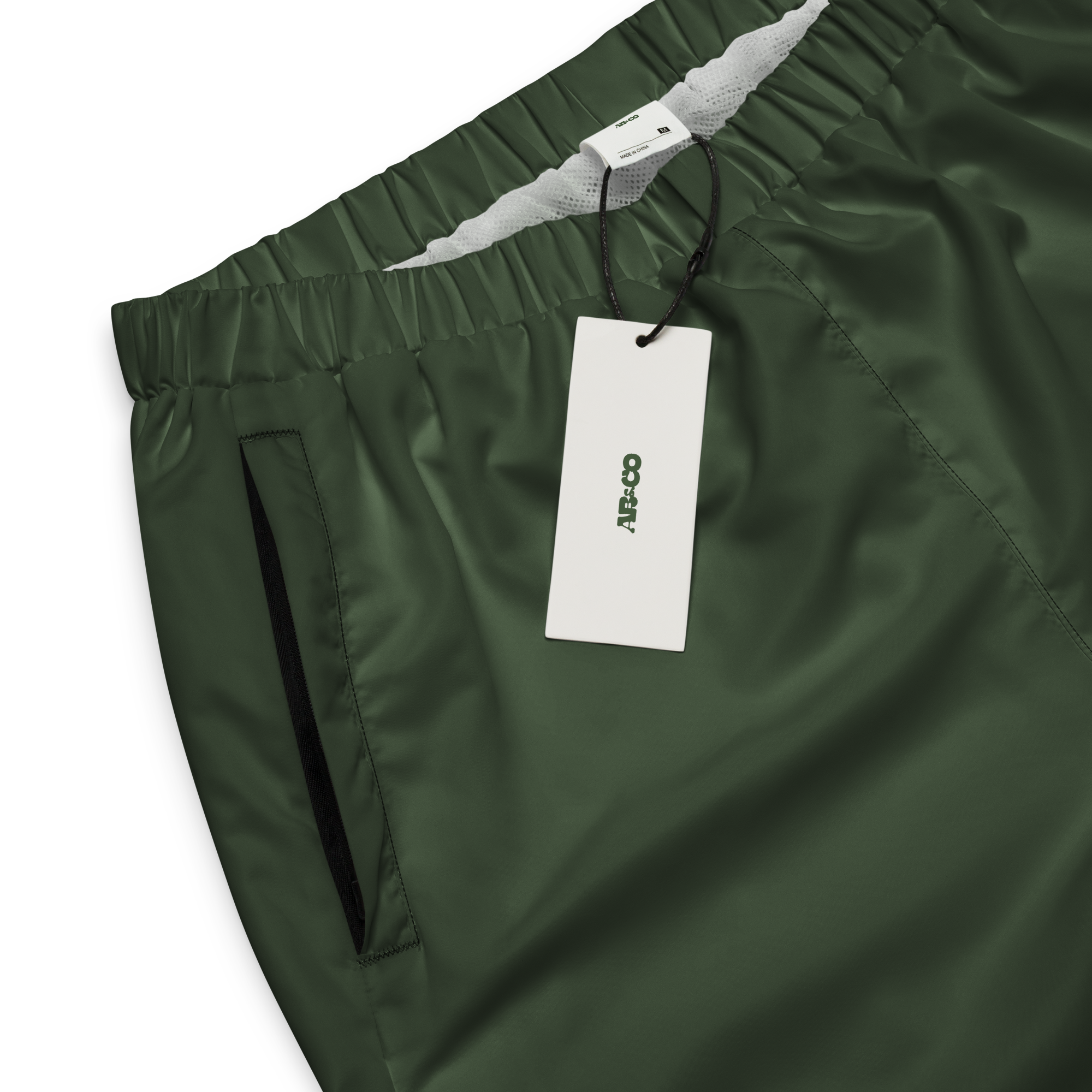 Unisex track pants in Olive with elastic waistband, tapered leg, and side pockets. Designed for casual streetwear and comfort.