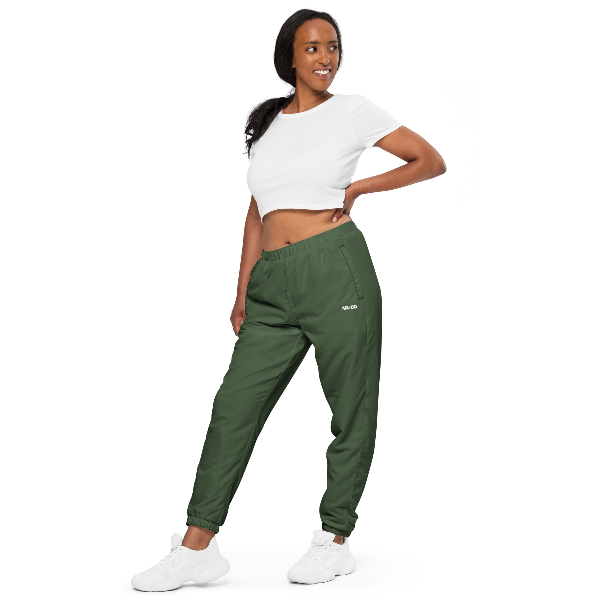 Unisex track pants in Olive with elastic waistband, tapered leg, and side pockets. Designed for casual streetwear and comfort.